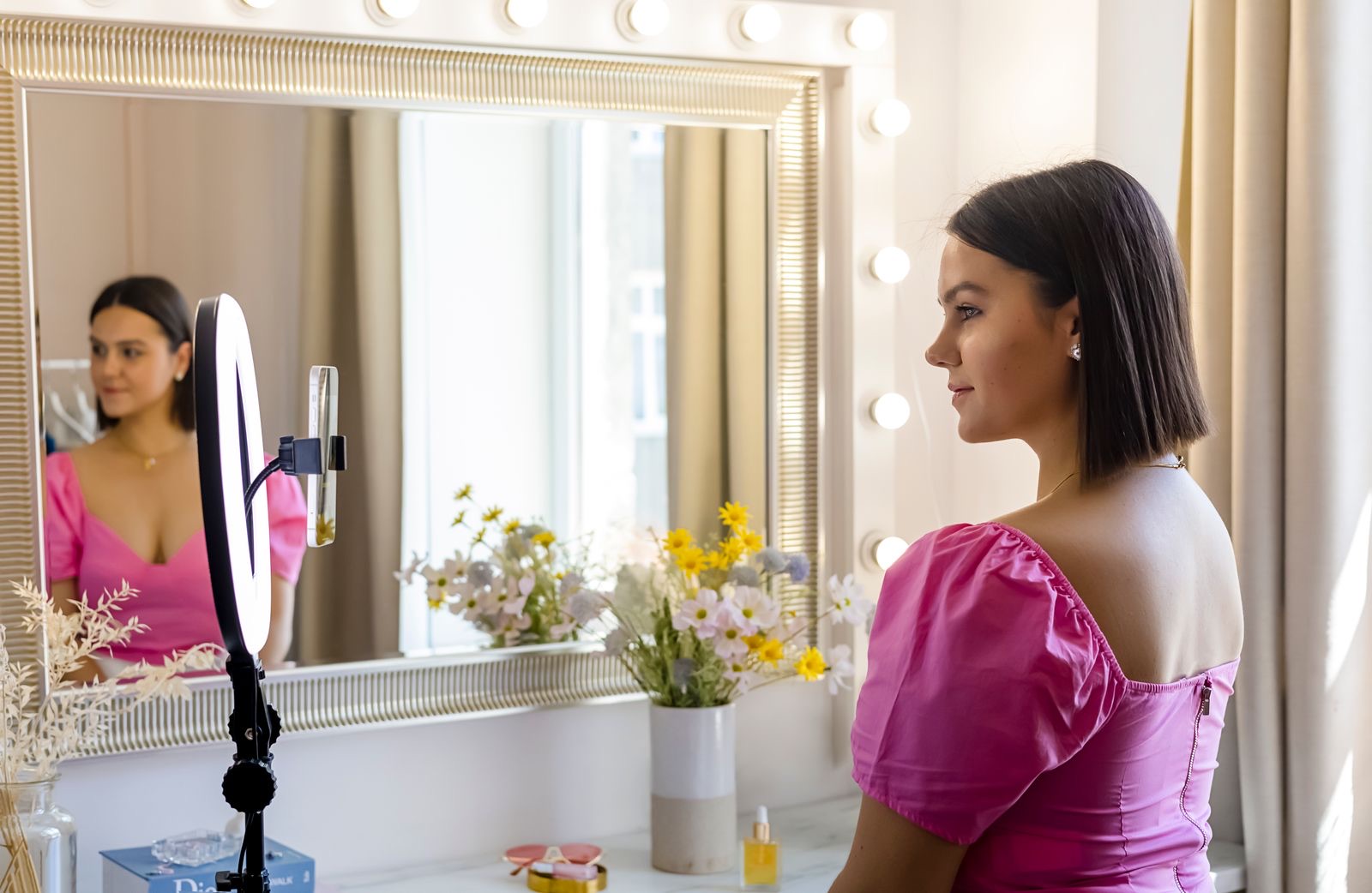 A content creator's ring light and camera setup